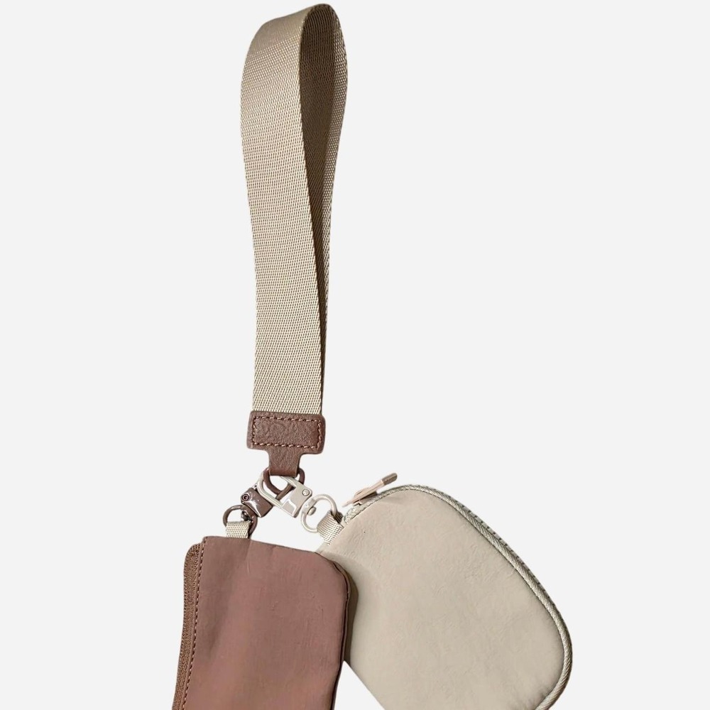 Multi-colored wristlet with beige strap and brown leather accents